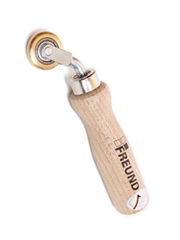 Freund Brass Pressure Roller with narrow convex brass wheel, solid mounting bracket, and ergonomic wooden handle
