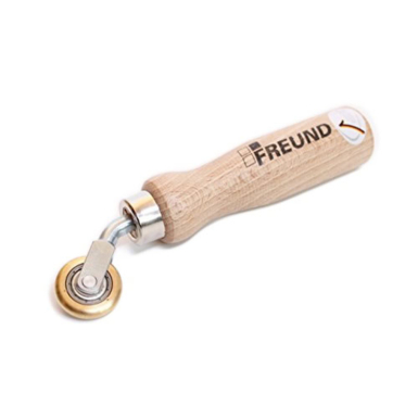 Freund Brass Pressure Roller with narrow convex brass wheel, solid mounting bracket, and ergonomic wooden handle